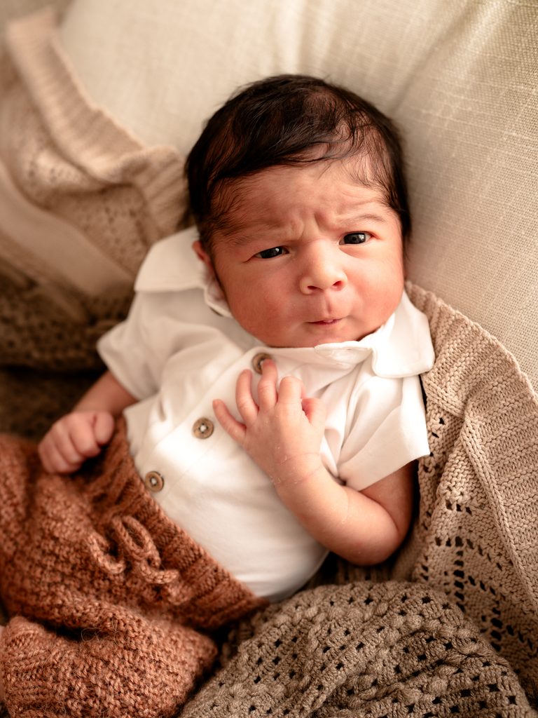 Awake baby with eyes open during a newborn photography session at Four O Photography