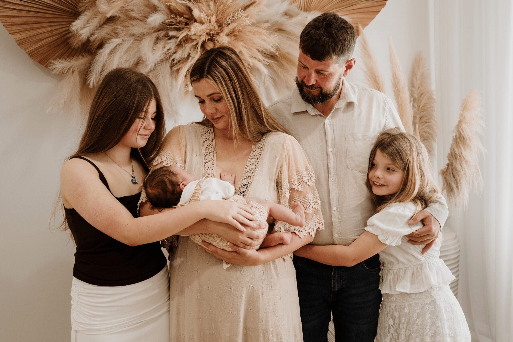 Family with their newborn baby during a newborn photography session in Hilbert Perth